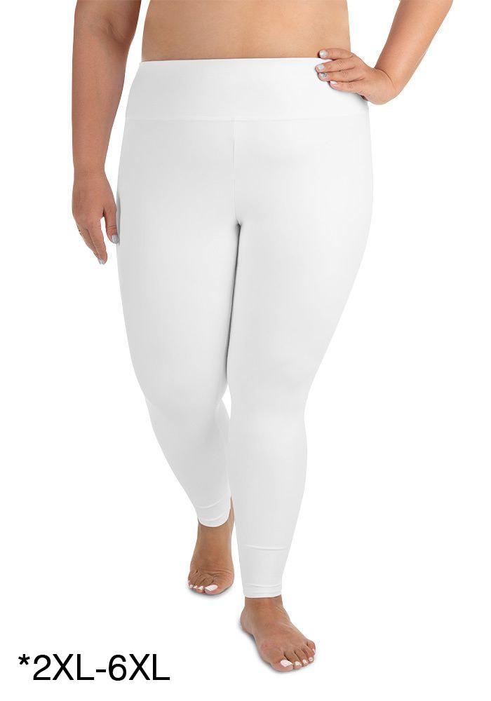 a woman wearing white pants and a bra