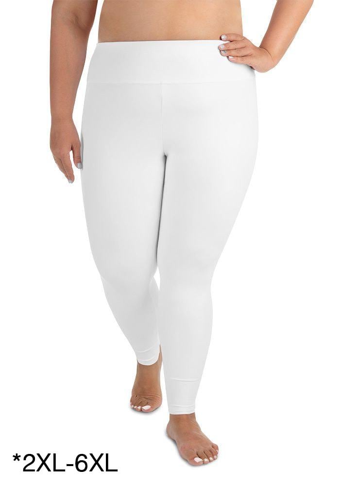 a woman wearing white pants and a bra